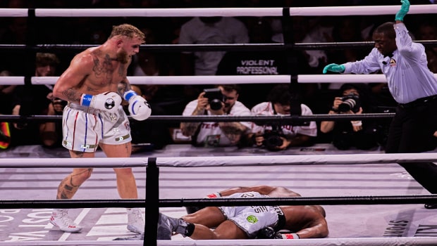Jake Paul is slowly making his bones and establishing himself as a fighter to reckon with. On Saturday night, Jake Paul earned a sixth-round victory over former MMA champion Tyron Woodley via a knockout punch in their rematch fight. Woodley, a former UFC Welterweight champion, was knocked out cold by Paul, a YouTuber who is now gaining grounds as a tough boxer. Many have hailed the victory as Jake Paul's best in his boxing career. Paul and Woodley met back in August, where Paul won via a split decision. The win came as a surprise as many expected the martial artist with an impressive fight record to have some advantage over Paul, who had only three fights in his record, before their August meeting. But Paul's performance then was able to impress two of the judges, who gave him the higher score. In the days leading up to the rematch, Woodley, who entered the fight as a replacement for Tommy Fury, vowed to knock out Paul and promised a defining win. But that did not happen. Instead, it was Woodley who lay flat on the floor, unable to move for some seconds. That was how powerful Paul's knockout punch was. The first two rounds of the fight were quite uneventful, and the crowd did not fail to hide their displeasure as the fight generally lacked energy. Woodley was not firing enough punches like he did in the first fight. It was the third round that things began to pick up. It was in that round that Woodley elbow grazed Paul on his forehead, resulting in a cut. This one action earned Woodley cheers from the crowd as people continued to boo Paul. Woodley, who was gaining the upper hand now, launched an uppercut that sent Paul's head back. Minutes later, Woodley was fouled after using his shoulder to push Paul to the floor, which was the first time Paul's back would touch the floor in their fight. The fifth round was very uneventful, but it was the sixth round that the damage was done. Paul found Woodley's chin and sent a punch that knocked the man out. Paul remains unbeaten in his professional boxing career, with five wins. Woodley has now lost his two professional boxing fights in the hands of the same man. Written by: Leon Osamor